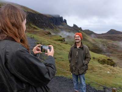 Couple taking photos at the Quiraing on Isle of Skye