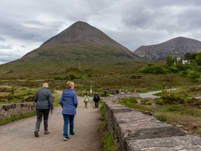 Couple walking Sligachan Bridge 