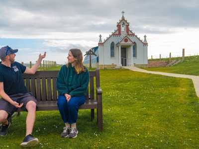 Highland Explorer Guide providing commentary at Italian Chapel on Orkney
