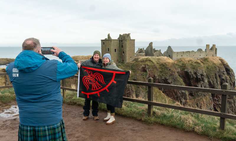 Large Couple Taking A Picture At Dunnottar Castle