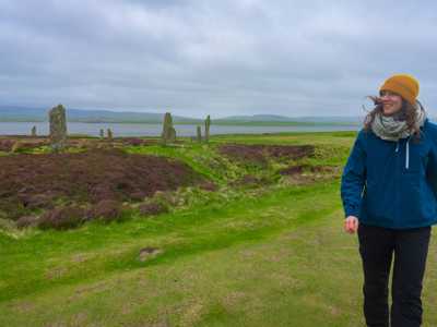 Woman walking around Ring of Brodgar on Orkney