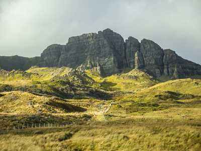 Rocky hills on grassy land on the Isle of Skye