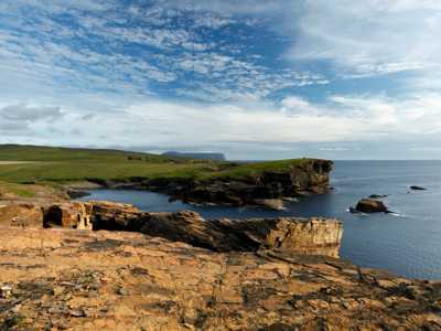 Yesnaby Cliffs on Orkney, with rugged cliffs towering over the crashing sea below