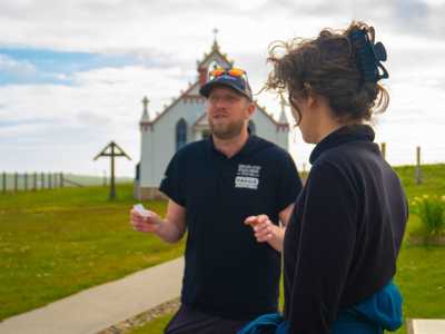 Highland Explorer Guide providing commentary at Italian Chapel on Orkney