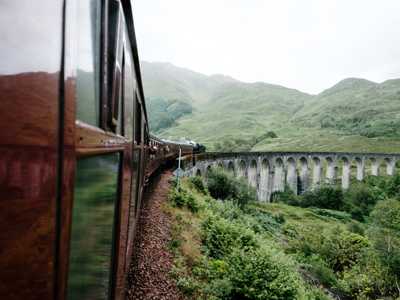 View from near the Jacobite Steam Train carriages as it crosses the Glenfinnan Viaduct, with the dramatic valley below