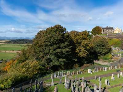 View over lush graveyard from a hill in Stirling